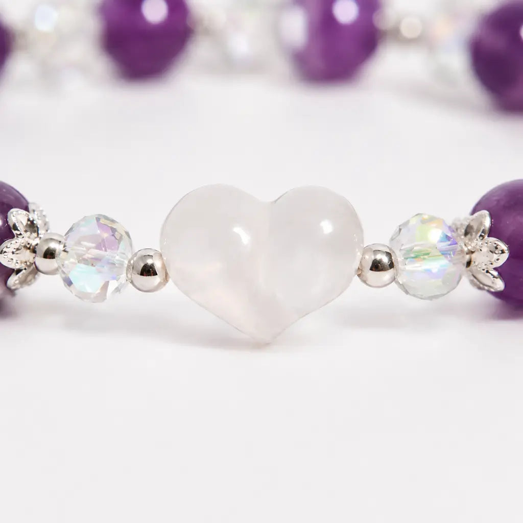 Amethyst white agate bracelet close-up featuring a polished white agate heart centerpiece with sparkling crystal beads and premium silver accents.