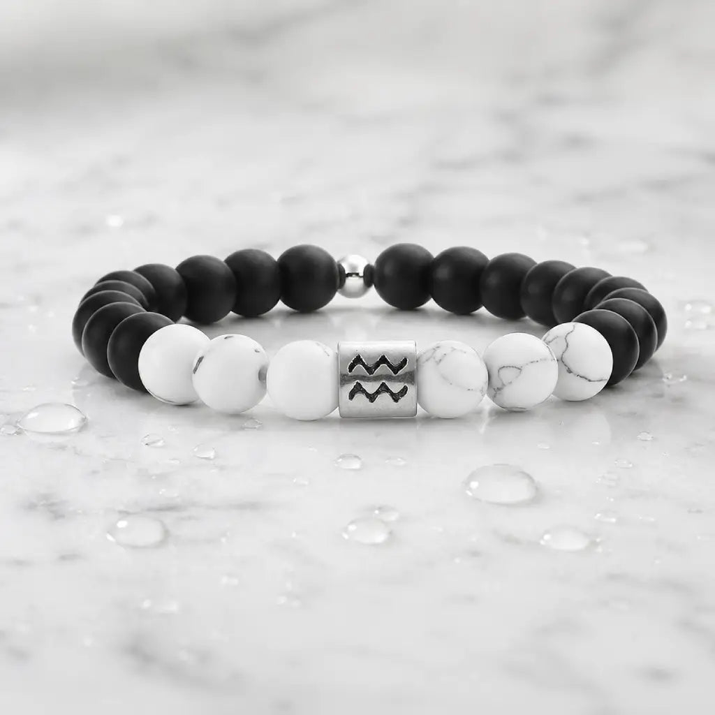 Aquarius zodiac bracelet on marble with water droplets, matte onyx, and howlite beads for fresh zodiac giftable style