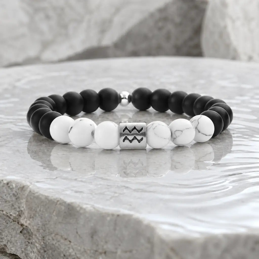 Aquarius zodiac bracelet with matte black onyx, white howlite beads, and silver charm for meaningful daily style