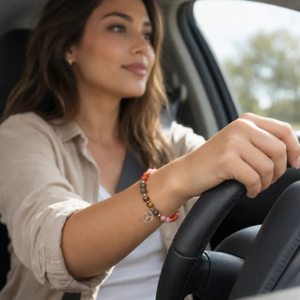 Aries crystal bracelet worn while driving featuring natural stones for confident everyday astrology inspired style