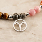 Aries crystal bracelet featuring silver zodiac charm and natural stones for stylish spiritual jewelry lovers