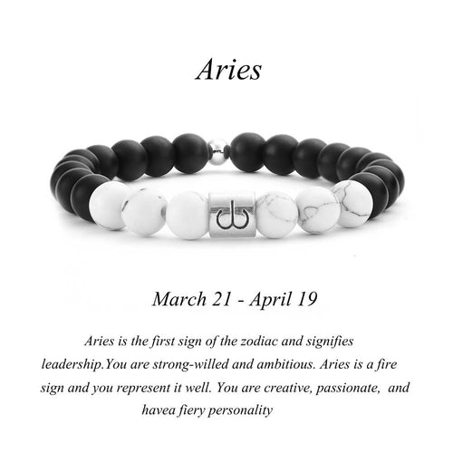 Aries zodiac bracelet with matte black Agate and white Howlite beads and a silver Aries ram charm on white background