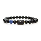 Aries zodiac bracelet isolated on white with black beads, blue stone accent, and minimalist product clarity appeal