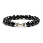 Barbell beaded bracelet in black with silver-color connector, showing 8 mm round beads, a dumbbell-shaped connector, and a circular unisex strand on a bright white product setting.
