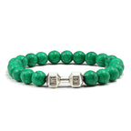 Barbell beaded bracelet in green with silver-color connector, showing 8 mm round beads, a dumbbell-shaped connector, and a circular unisex strand on a bright white product setting.