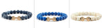 Barbell beaded bracelet in six-color coordinated Set selection, showing 8 mm round beads, a dumbbell-shaped connector, and a circular unisex strand on a clean white studio setting.