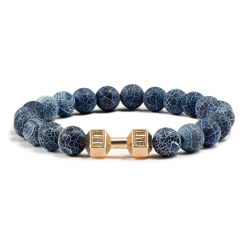 Barbell beaded bracelet in weathered dark blue with gold-color connector, showing 8 mm round beads, a dumbbell-shaped connector, and a circular unisex strand on a white background.