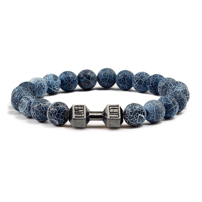 Barbell beaded bracelet in weathered dark blue with gun-black connector, showing 8 mm round beads, a dumbbell-shaped connector, and a circular unisex strand in a clean studio view.