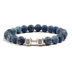 Barbell beaded bracelet in weathered dark blue with silver-color connector, showing 8 mm round beads, a dumbbell-shaped connector, and a circular unisex strand on a white backdrop.