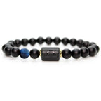 Libra zodiac bracelet with glossy black beads, blue accent stone, and engraved center bead on agate plate with smoke.