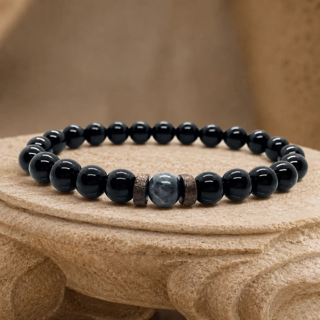 Black Obsidian labradorite beaded gemstone bracelet displayed on a natural stone pedestal with polished premium finish for stylish everyday wear.