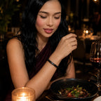 Black Obsidian labradorite bracelet worn by a woman at dinner featuring polished gemstone beads for elegant fashion and timeless accessories.