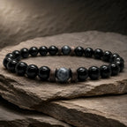 Black Obsidian labradorite natural stone bracelet showcased on layered slate rock with polished crystal beads for timeless modern style.
