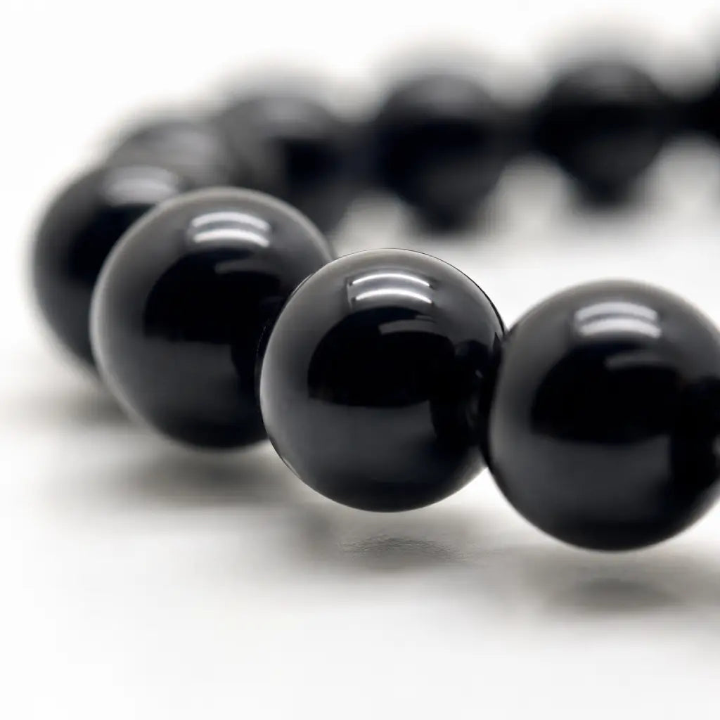 Black Obsidian labradorite bracelet macro featuring glossy obsidian gemstone beads with polished finish for handcrafted premium crystal jewelry.