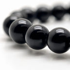 Black Obsidian labradorite bracelet macro featuring glossy obsidian gemstone beads with polished finish for handcrafted premium crystal jewelry.