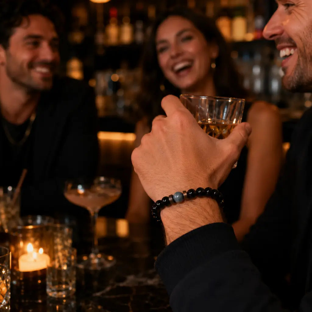 Black Obsidian labradorite gemstone bracelet worn during a social gathering featuring polished crystal beads for refined modern style.