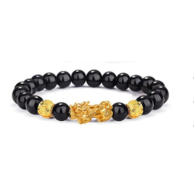 Black Obsidian Pixiu bracelet with glossy black beads and a gold Pixiu charm on white background