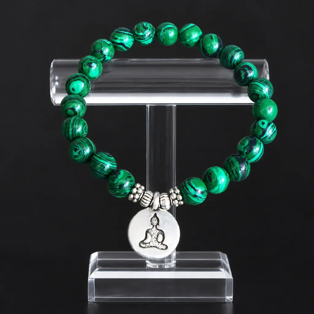 Buddha green tigereye bracelet displayed on acrylic stand, striped green beads with silver meditation Buddha charm