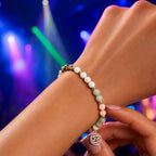 Cancer bracelet worn during evening outing featuring pastel gemstones and zodiac charm for stylish astrology fashion