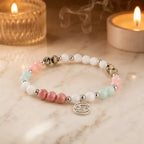 Cancer bracelet styled beside candles highlighting gemstone energy spiritual jewelry and zodiac symbolism