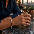 Cancer bracelet worn at an upscale rooftop bar featuring pastel gemstone beads and zodiac charm for elegant style