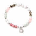 Cancer bracelet isolated on white background showing gemstone bead arrangement and silver zodiac charm clearly