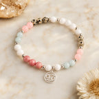 Cancer bracelet displayed with healing gemstones and zodiac charm creating a thoughtful astrology gift idea
