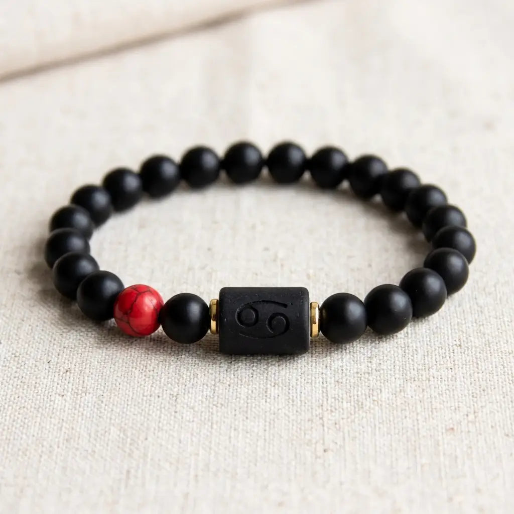 Cancer zodiac bracelet black beaded design with red stone accent and engraved charm for stylish spiritual balance wear