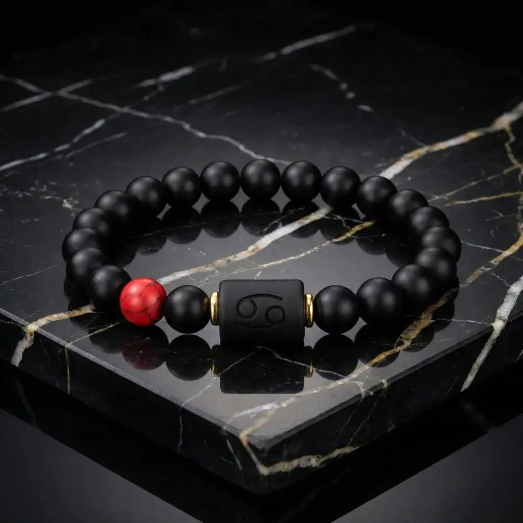 Cancer zodiac bracelet black beads with red accent on marble surface showcasing high end luxury jewelry styling and refined modern appeal