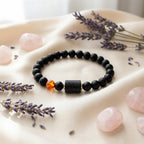 Capricorn zodiac bracelet styled with lavender and rose quartz, black beads and amber charm create soothing wellness aesthetic
