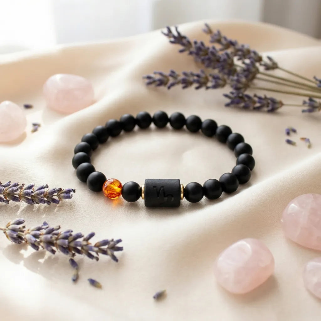 Capricorn zodiac bracelet styled with lavender and rose quartz, black beads and amber charm create soothing wellness aesthetic