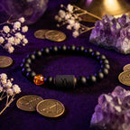 Capricorn zodiac bracelet with crystals and zodiac coins, black beads and amber accent highlight astrology inspired design