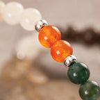 Capricorn zodiac gemstone bracelet close up showcasing natural crystal beads and silver charm for stylish spiritual jewelry.