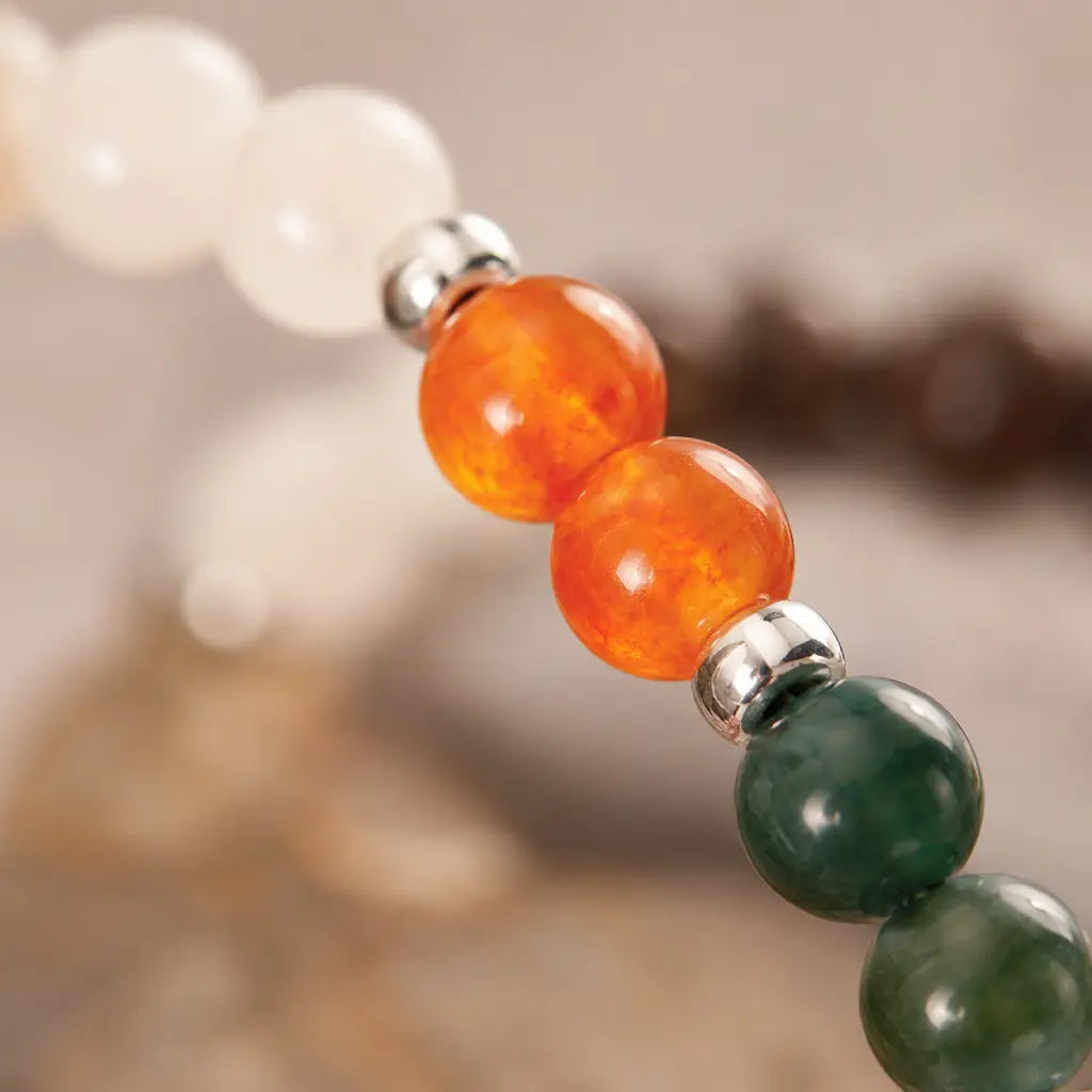 Capricorn zodiac gemstone bracelet close up showcasing natural crystal beads and silver charm for stylish spiritual jewelry.
