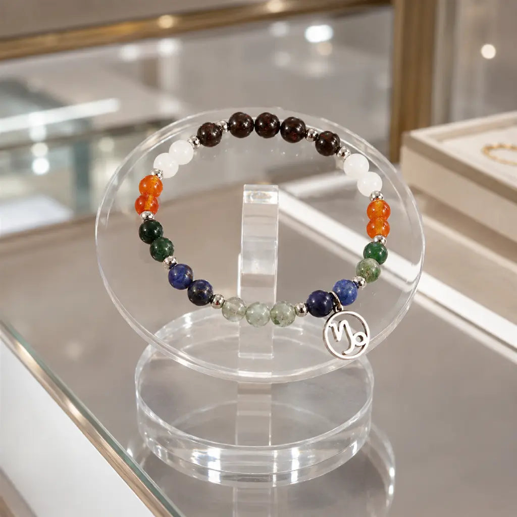 Capricorn zodiac crystal bracelet displayed on a clear acrylic stand featuring natural gemstone beads and luxury astrology jewelry appeal.