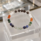 Capricorn zodiac gemstone bracelet displayed on a clear jewelry stand highlighting premium crystals and artisan craftsmanship.