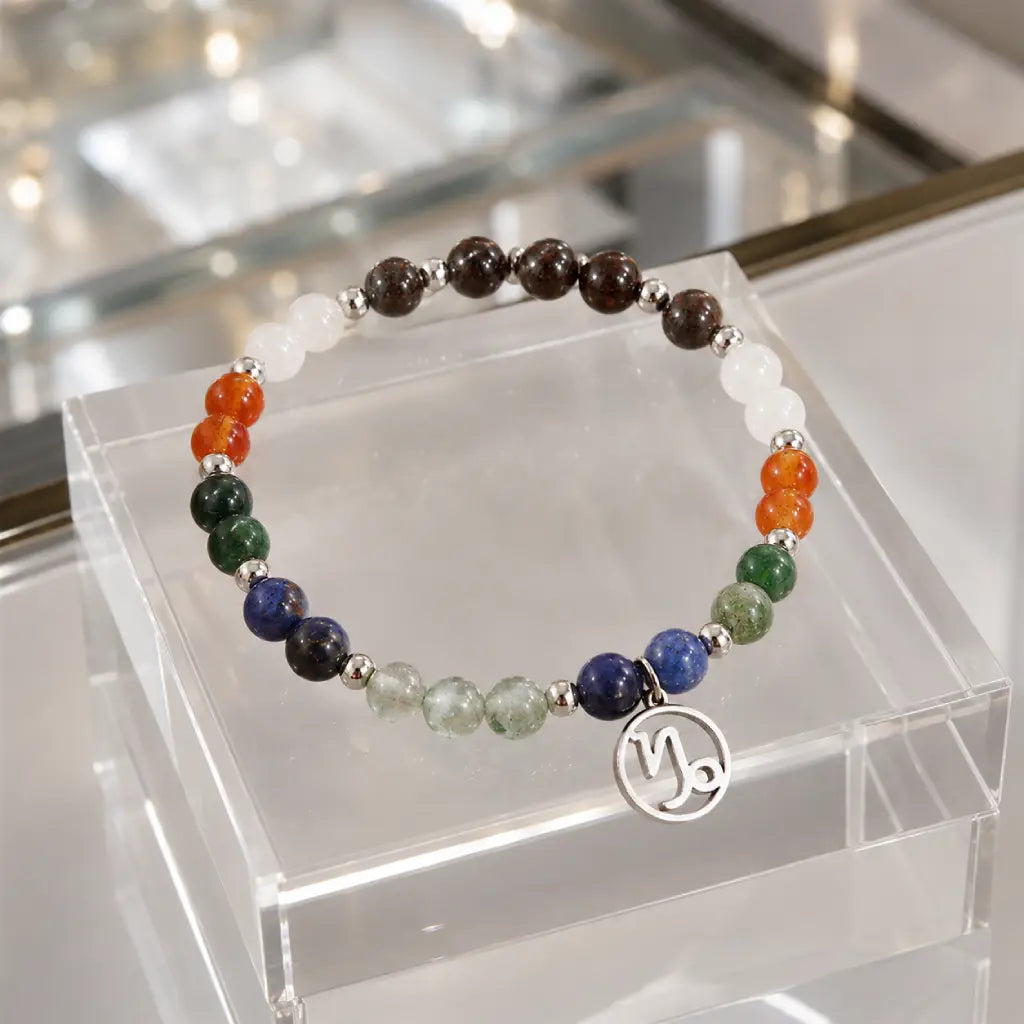 Capricorn zodiac gemstone bracelet displayed on a clear jewelry stand highlighting premium crystals and artisan craftsmanship.