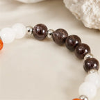 Capricorn zodiac crystal bracelet featuring vibrant carnelian gemstone beads designed to inspire motivation and personal growth.