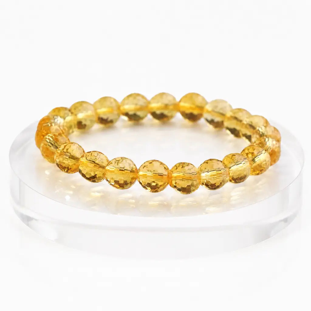 Citrine jewelry displayed on premium stand with faceted gemstone bracelet for refined luxury presentation