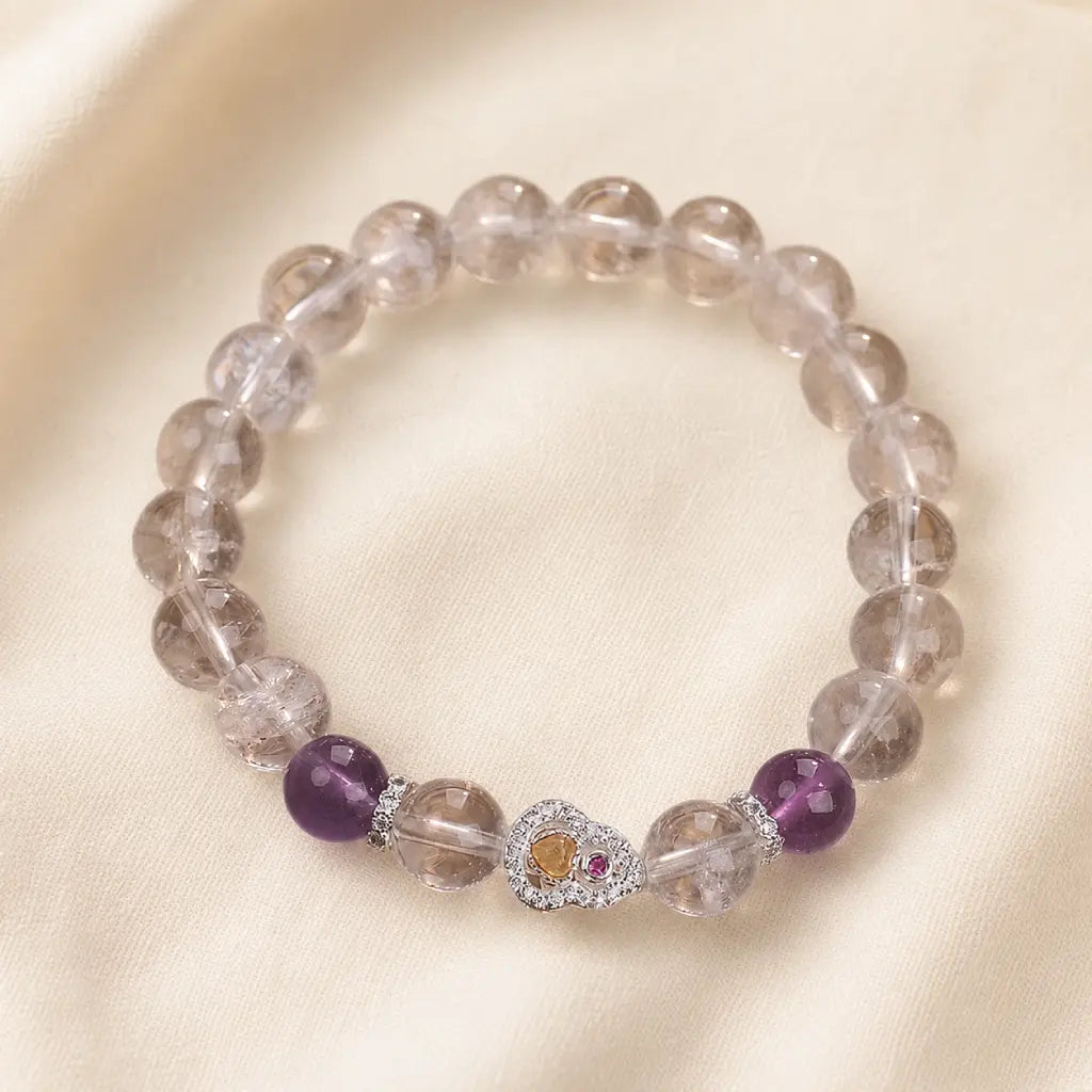 Healing crystal bracelet with smoky quartz and amethyst beads designed for balanced energy and style