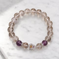 Healing crystal bracelet with smoky beads and purple gemstones for powerful spiritual style and focus
