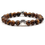 Dog paw stone bracelet with golden-brown tiger eye beads, showing 8 mm round beads, a silver-color paw-print charm, a heart accent, and a circular unisex design on a white display.