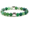 Dog paw stone bracelet with green multitone beads, showing 8 mm round beads, a silver-color paw-print charm, a heart accent, and a circular unisex design on a clean white backdrop.