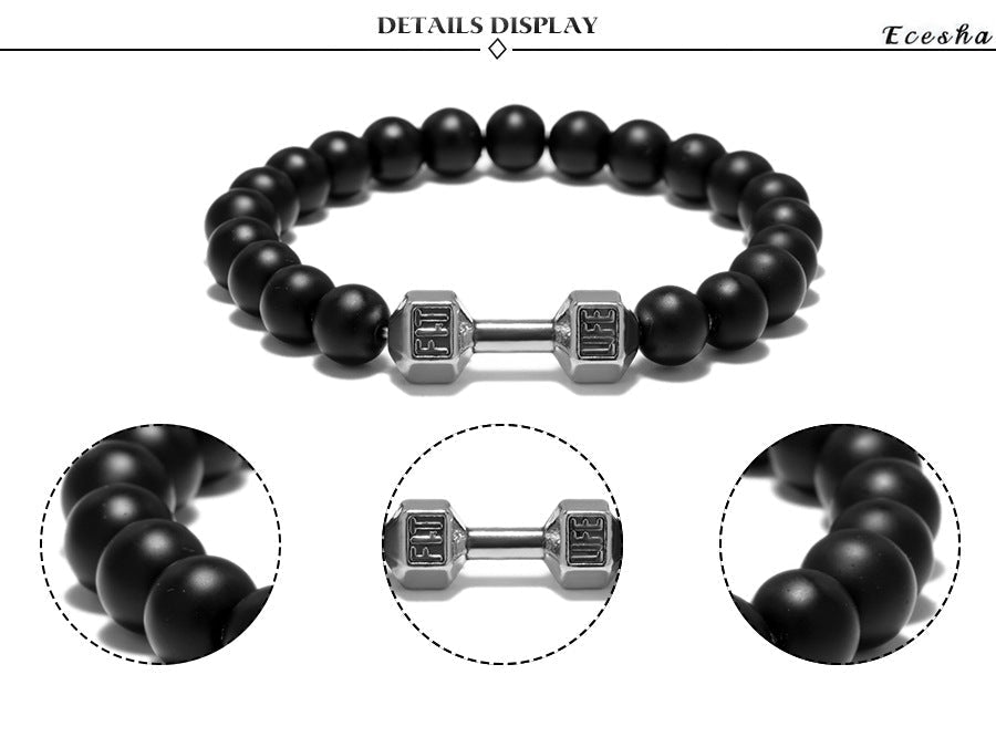 Dumbbell bracelet detail display with matte black agate beads and a silver-tone FIT LIFT centerpiece, including close views of the faceted dumbbell ends and the smooth bead finish.