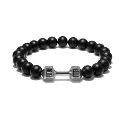 Dumbbell bracelet with matte black agate beads and a silver-tone FIT LIFT centerpiece, shown in a clean, front-facing circle on white to fully show the elastic beaded construction.