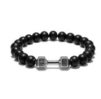 Dumbbell bracelet with matte black agate beads and a silver-tone FIT LIFT centerpiece, shown in a clean, front-facing circle on white to fully show the elastic beaded construction.