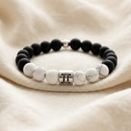 Gemini bracelet on soft linen with black onyx, white howlite beads, and silver charm for airy zodiac style gift