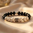 Gemini bracelet on satin with matte onyx, white howlite beads, and silver twins charm for bright luxury gift appeal