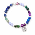 gemini Multicolored beaded bracelet with a silver zodiac charm on a white background