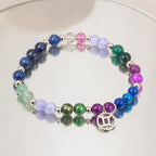 Gemini zodiac beaded bracelet reflected on mirror surface. Best healing stone jewelry with Gemini symbol charm. Perfect astrology gift for June birthdays.